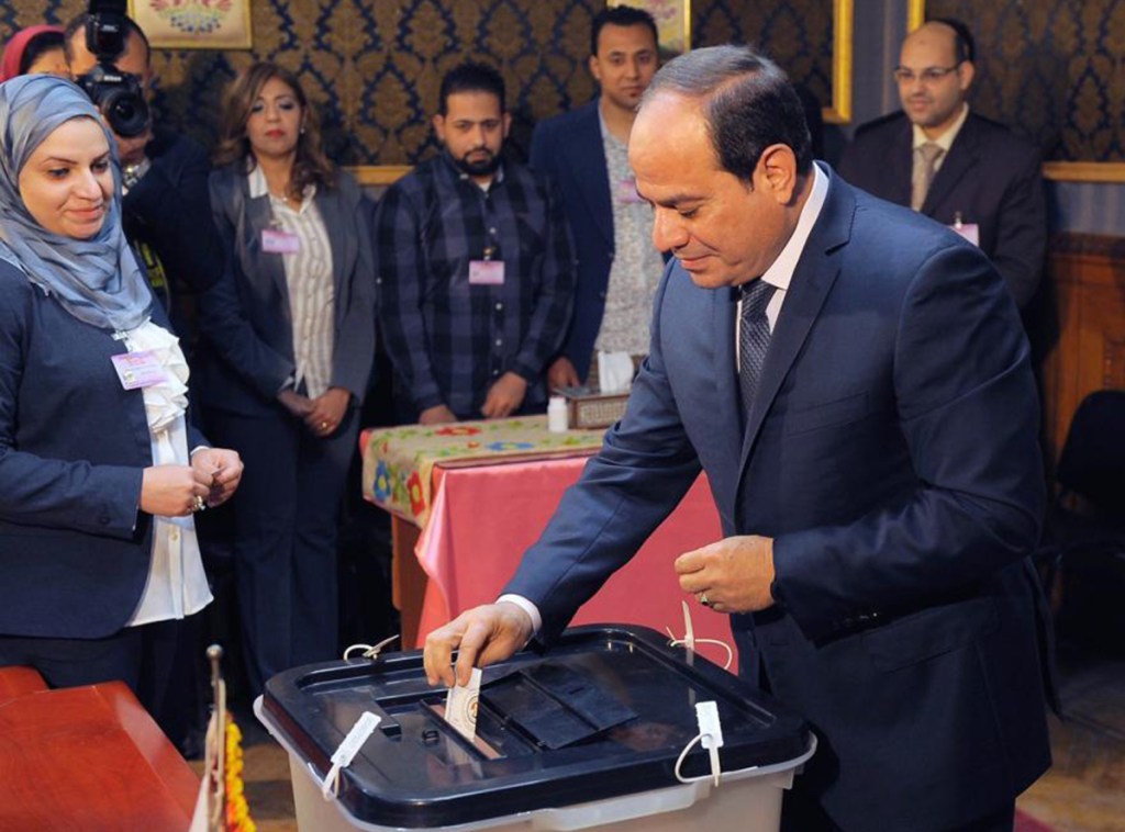 Egyptian President Abdel-Fattah el-Sissi votes in Cairo, Egypt, where he is running largely unopposed. Voting is being pushed as a patriotic duty.