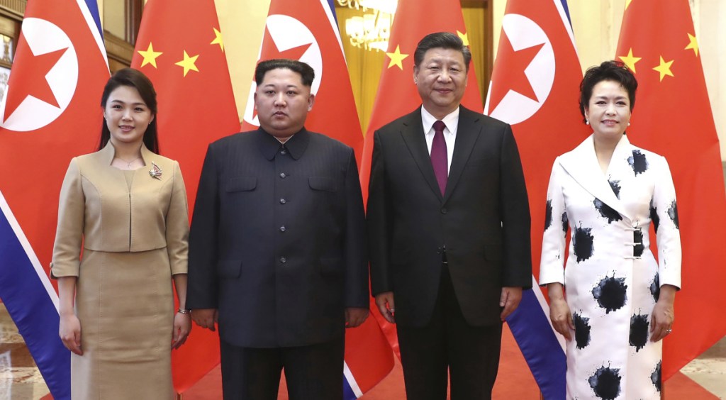 Chinese President Xi Jinping, second from right, and his wife, Peng Liyuan, right, hosted North Korean leader Kim Jong Un, second from left, and his wife, Ri Sol Ju, at the Great Hall of the People in Beijing.