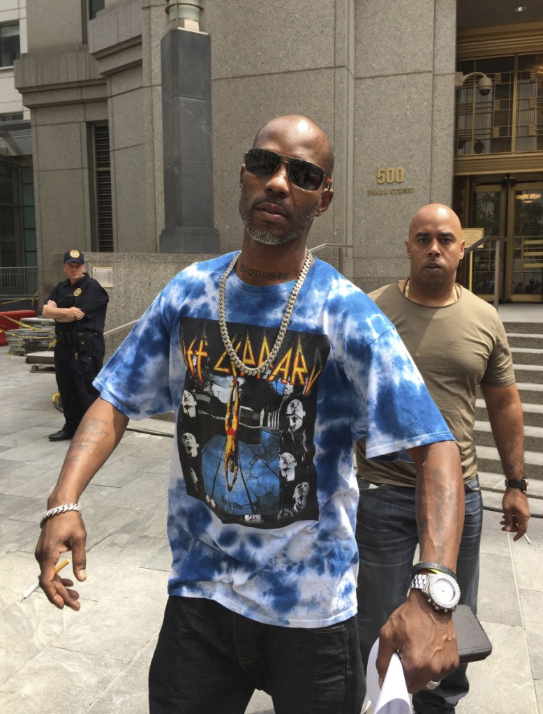 DMX smokes a cigarette after leaving Manhattan federal court in New York following an appearance in his tax fraud case. DMX  was sentenced to a year in prison for trying to dodge $1.7 million in taxes.