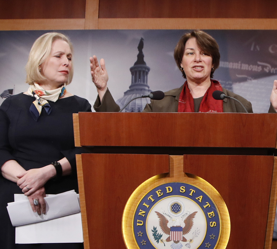 Sen. Amy Klobuchar, D-Minn., right, and Sen. Kirsten Gillibrand, D-N.Y., are helping to lead an effort in the Senate to update rules on sexual harassment and discrimination.