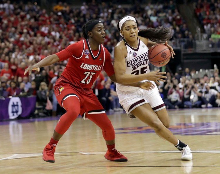 Mississippi State's Victoria Vivians goes to the basket against Louisville's Jazmine Jones during the second half of the Bulldogs' 73-63 win in the Final Four on Friday in Columbus, Ohio.