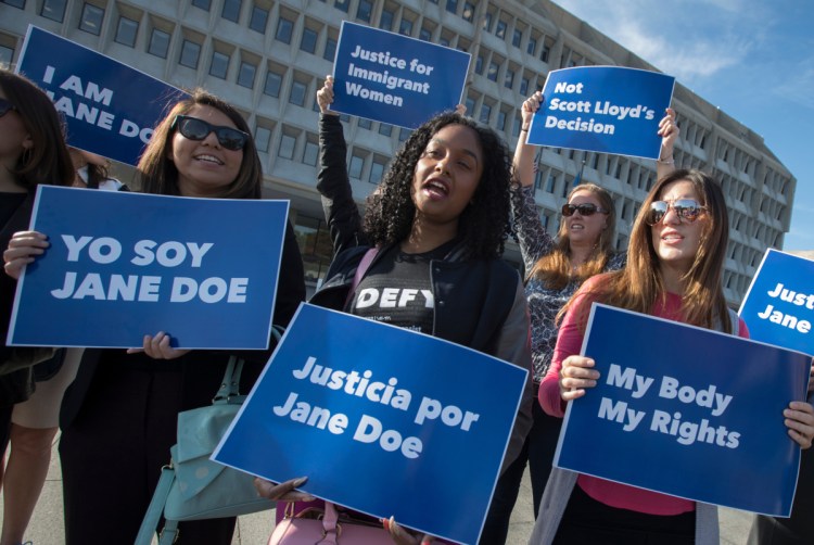 Activists in October 2017 support an immigrant teen's right to obtain an abortion while in U.S. custody. On Friday, a court ruled the government can't interfere with that right. 