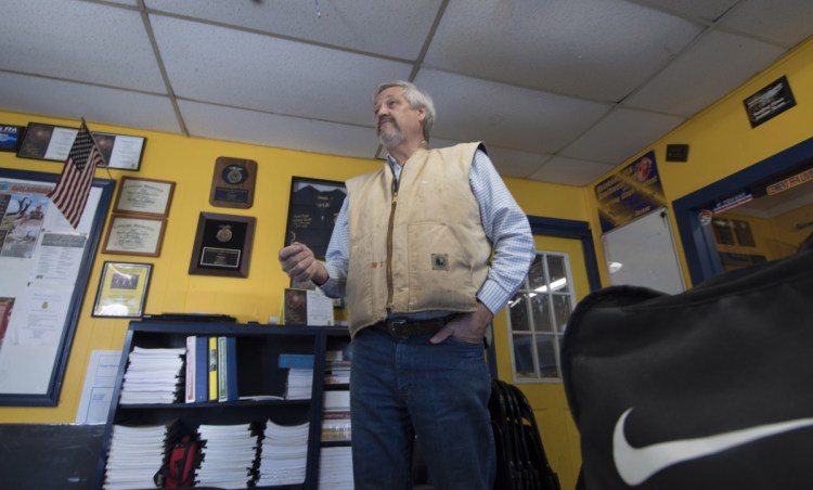 Robert Bohn works with his agriculture class at Cement High School in Cement, Okla. He has been teaching for nearly 20 years and says he's could make $20,000 a year more elsewhere. "Texas is just an hour that way," he said, pointing down a two-lane highway.