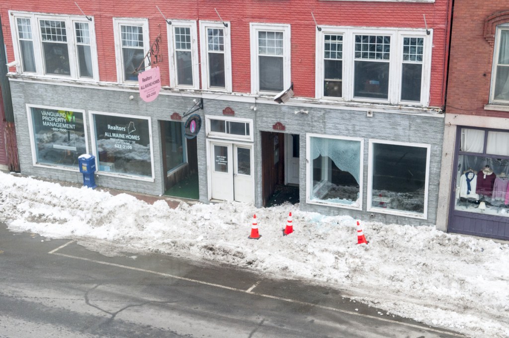 Damage to the window of unoccupied store front at 106 Water St. is seen Thursday in downtown Hallowell. Earlier in the morning, a hit-and-run driver of a tractor trailer failed to stop at intersection of Water and Winthrop Streets then struck a street light, which broke the window.