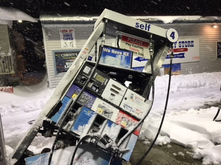 This fuel pump in front of Christy's Country Store in Belgrade was struck by a plow truck last week during a snowstorm. Efforts to clean up the estimated 1,800 gallons of spilled fuel are underway.
