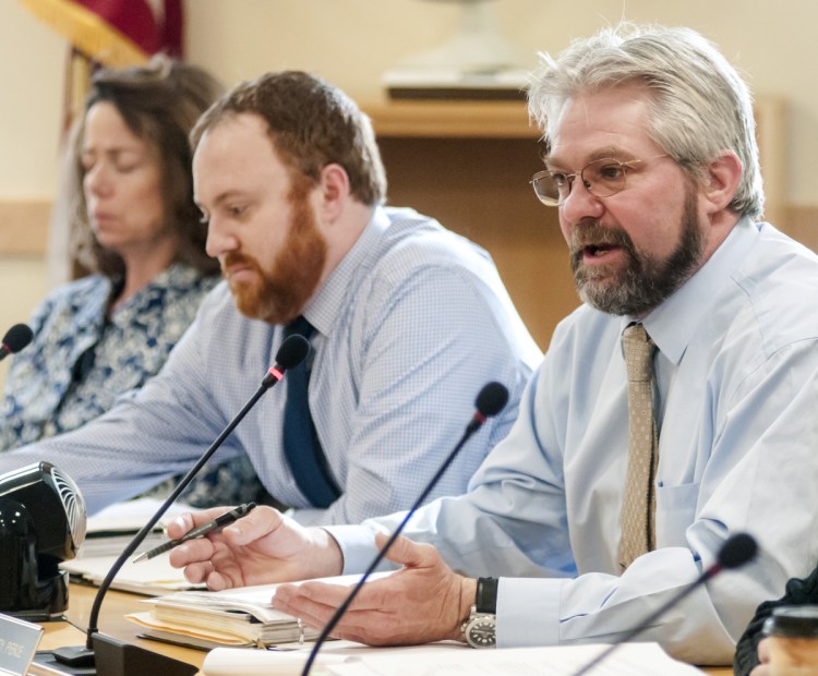 Rep. Jeffery Pierce, R-Dresden, right, asks a question during a meeting of the Government Oversight Committee on Friday in the Cross State Office Building in Augusta. Pierce voted against having the Department of Labor and its unemployment filing system investigated.