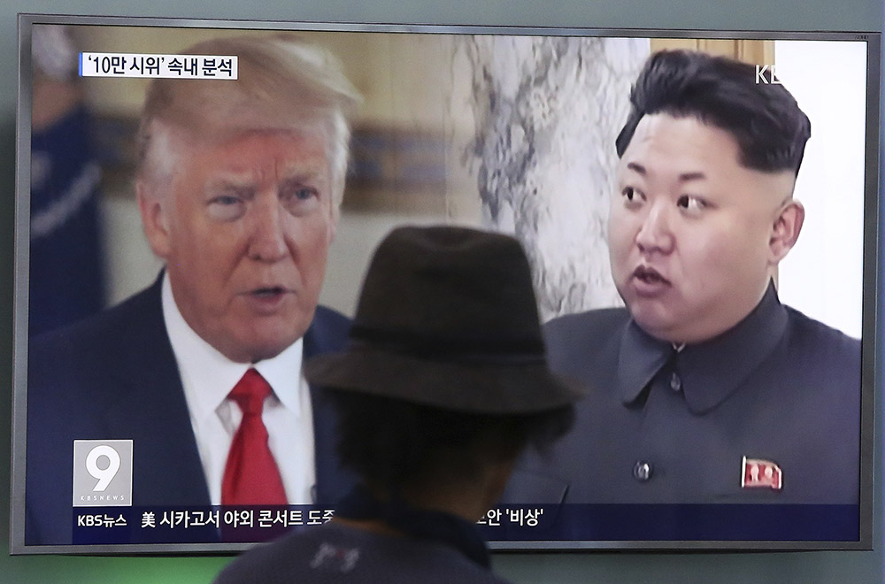 A television screen in Seoul, South Korea, shows President Trump and North Korean leader Kim Jong Un during a news program in August. South Korea's national security director said Thursday that the two will meet "by May."