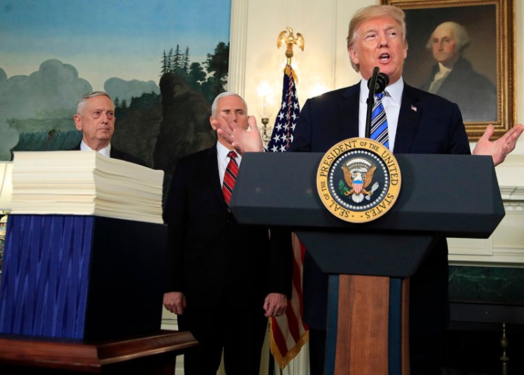 President Donald Trump with, Defense Secretary Jim Mattis, left, and Vice President Mike Pence, speaking at the White House on Friday.