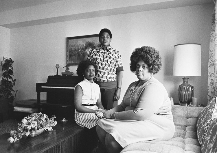 In this April 30, 1974, photo, Linda Brown, right, and her two children pose for a photo in their home in Topeka, Kan. Brown, the Kansas girl at the center of the 1954 U.S. Supreme Court ruling that struck down racial segregation in schools, has died at age 75. Peaceful Rest Funeral Chapel of Topeka confirmed that Linda Brown died Sunday.