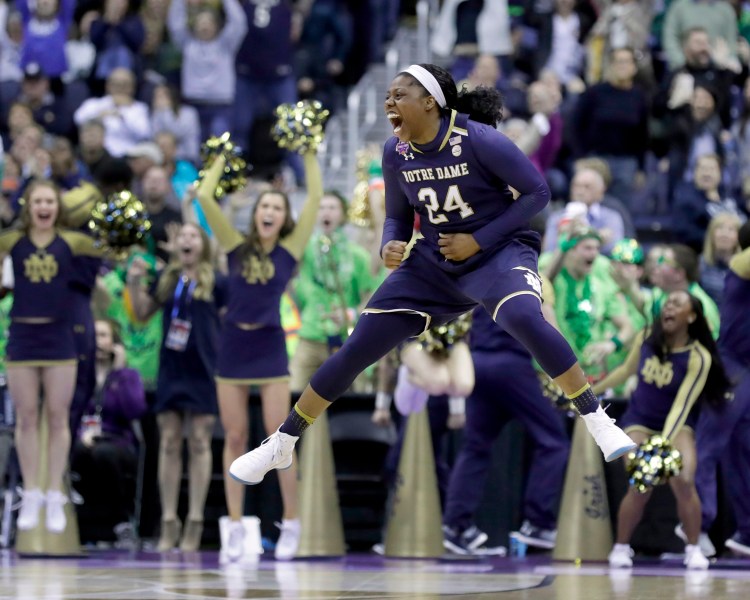 Notre Dame's Arike Ogunbowale celebrates after making the game-winning basket during overtime against Connecticut in the semifinals of the women's NCAA Final Four college basketball tournament, Friday, March 30, 2018, in Columbus, Ohio. Notre Dame won 91-89. (AP Photo/Ron Schwane)