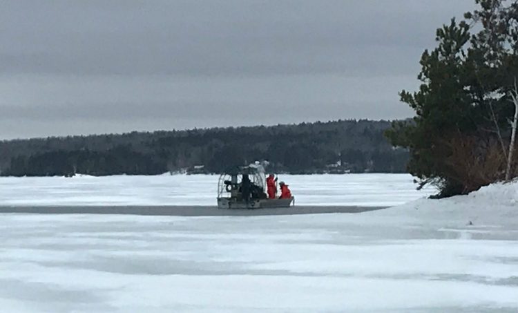 Game wardens use a Maine Warden Service airboat as they work to recover the body of Matthew Dubien from Moosehead Lake on Wednesday.