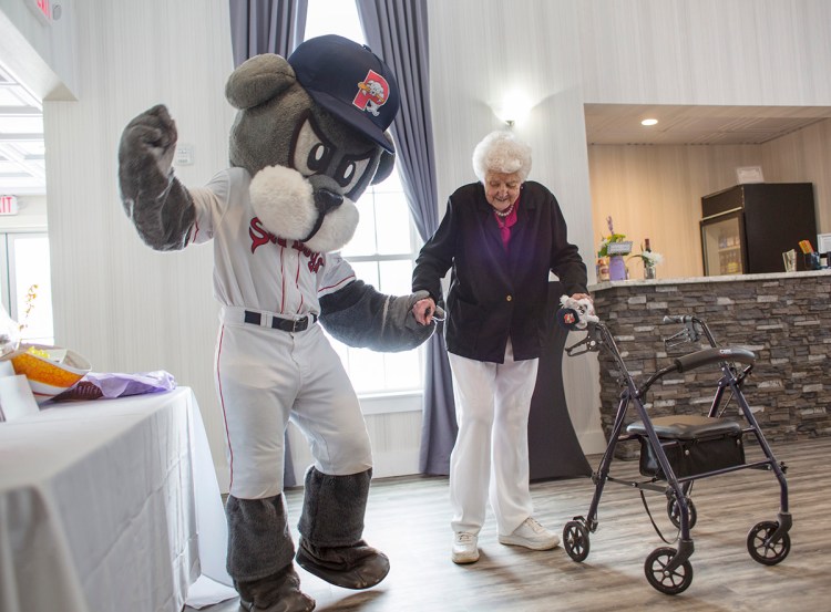 Slugger and Betty Stetson dance during her 100th birthday party in Windham. The Red Sox sent a letter thanking her for her support. The Red Sox won three World Series titles during her lifetime; the first was the 1918 series when Babe Ruth led the team to the championship. 