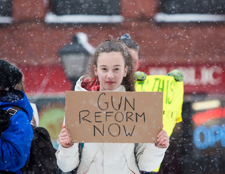 Mali Jones, 13, a seventh-grader at King Middle School joins a group students protesting gun laws at Monument Square, Portland on March 14, 2018.