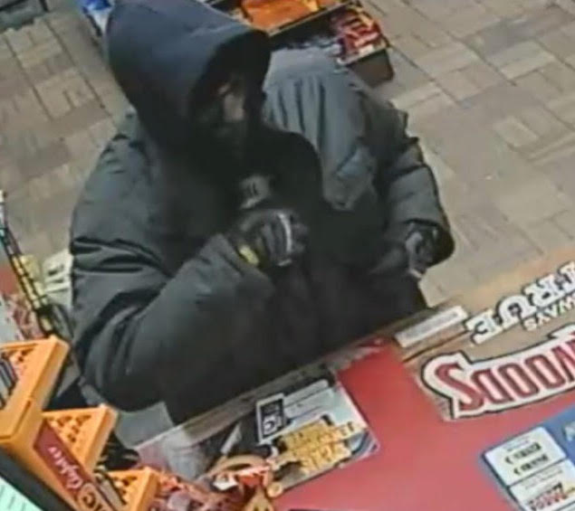The man who robbed the Riverton Gas Station in Portland on Tuesday night, shown in a security camera image, was described as white and about 30 years old. He is about 5-feet-5-inches tall with a thin build. He was wearing a heavy dark jacket, dark cap, dark gloves and a half-face ski mask. 
