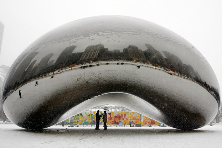 The 110-ton stainless steel Anish Kapoor sculpture called "Cloud Gate" and nicknamed "The Bean" at Millennium Park in Chicago photographed in 2008.