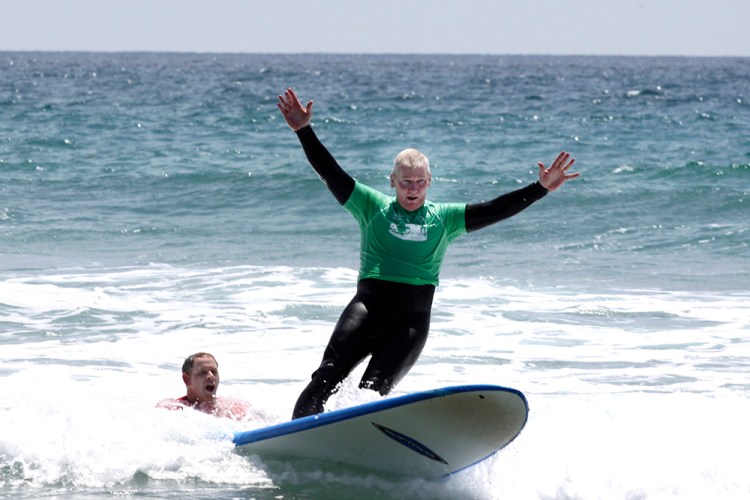 Marine Lt. Gen. John Toolan surfs at Marine Corps Base Camp Pendleton with the Jimmy Miller Foundation in 2014. 