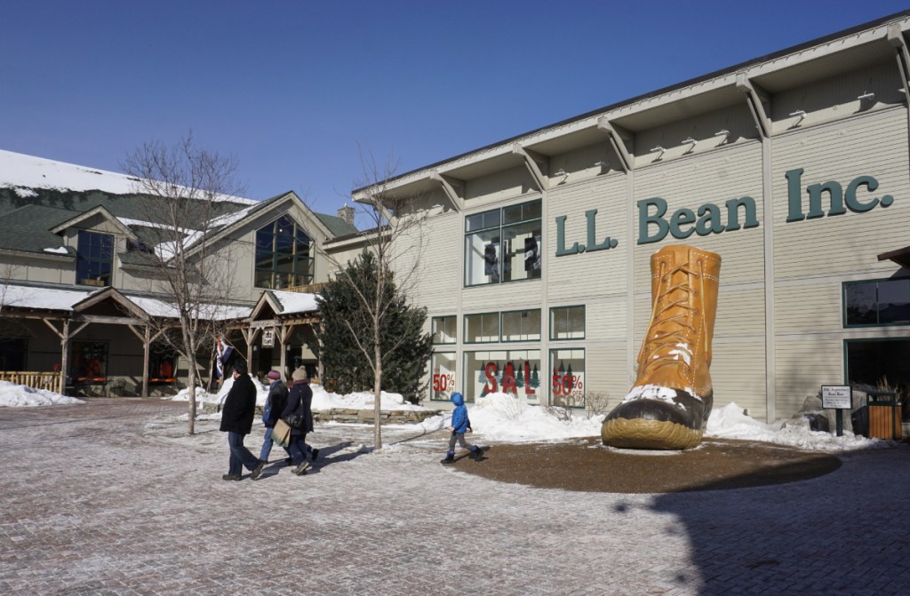 People walk through a plaza at an entrance to the L.L. Bean flagship store in Freeport last winter. Massachusetts customers of L.L. Bean won't have to drive to Maine to buy duck boots and brushed fleece pullovers.
The New England outdoor retailer is opening its first urban retail store in Boston on April 6. The 8,600-square-foot store at One Seaport will sell casual and active apparel, footwear and outdoor gear. Doors will open at 9 a.m., and the first 100 customers in line will receive a store gift card worth up to $500. Red Sox legends Jim Rice and Luis Tiant will be at the event, which coincides with Red Sox opening weekend. The Maine-based company is excited to have its first city store in Boston, citing the "outdoor spirit" of Bostonians as one of its reasons for choosing the location. L.L. Bean's sales dipped slightly over the past year, prompting the retailer to cut close to 100 jobs and forcing the elimination of worker bonuses for the first time since 2008.