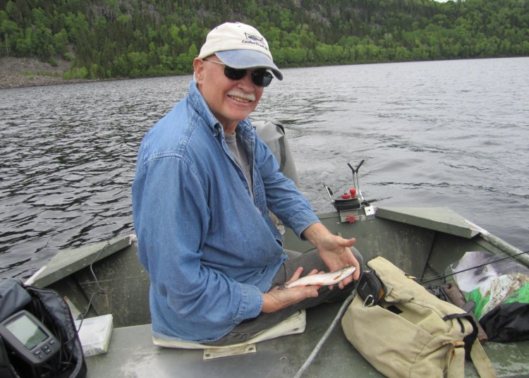 Lowell Mason of Wilmington, N.C., holds an Arctic char, also called a blueback trout, he caught in the Deboullie Preserve in northern Maine. Mason drove two days from North Carolina, trailering his boat for a chance to catch the wild fish, which is in 14 waters in Maine, the only state with them in the Lower 48.