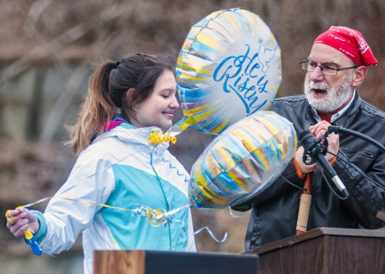 Shantel Walsh and the Rev. Ted Chaffee present a skit, "Good Question – Great Answer," about the grammatical and religious stories behind the phrase "He is risen" during an Easter sunrise service in Gardiner's Waterfront Park.