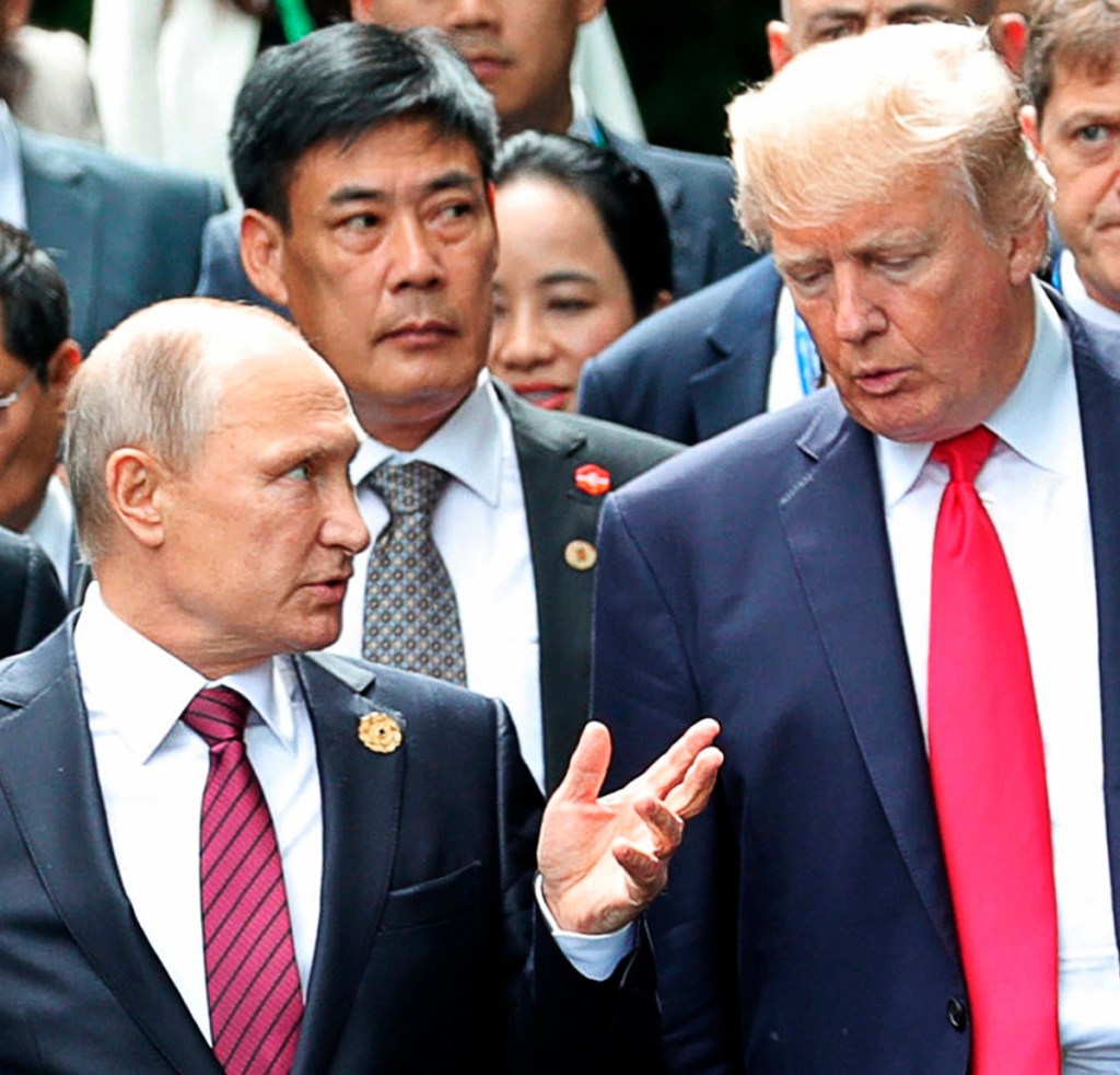President Trump and Russian President Vladimir Putin talk at the APEC Summit last November. Trump is opening the door to a potential White House meeting with Putin.