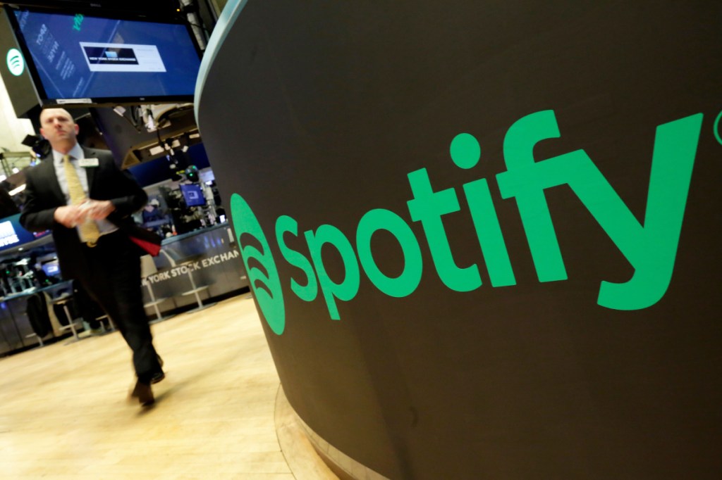 A trading post sports the Spotify logo on the floor of the New York Stock Exchange. Spotify is the No. 1 music streaming service, and its success has drawn comparisons to the Netflix video service.