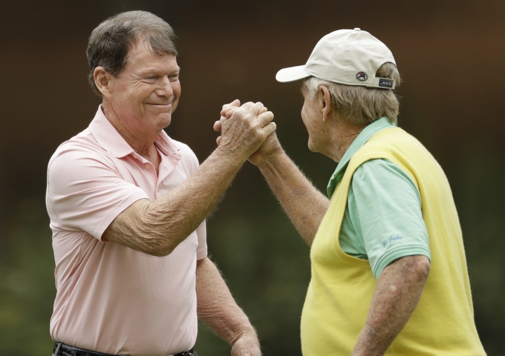 Jack Nicklaus and Tom Watson shake hands Wednesday after playing together during Par-3 Tournament preceding the Masters at Augusta National in Georgia. Watson won the event by one shot.