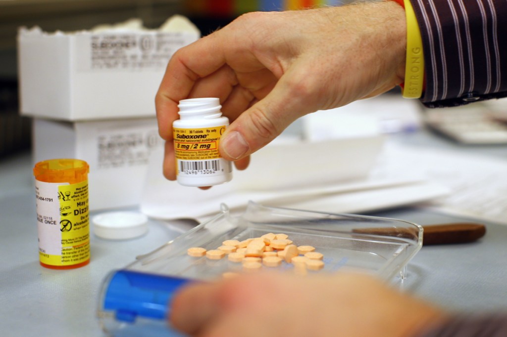 A Boston pharmacist fills a Suboxone prescription in 2013. Legislation approved by both chambers of the Maine Legislature would allocate $6.6 million annually for medication-assisted treatment of uninsured drug users.