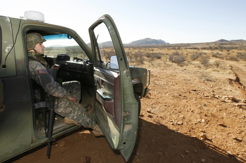 A National Guard unit patrols at the Arizona-Mexico border in Sasabe, Arizona, in 2007. National Guard contingents say they are waiting for guidance from Washington to determine what they will do following President Trump's proclamation directing deployment to fight illegal immigration and drug smuggling.