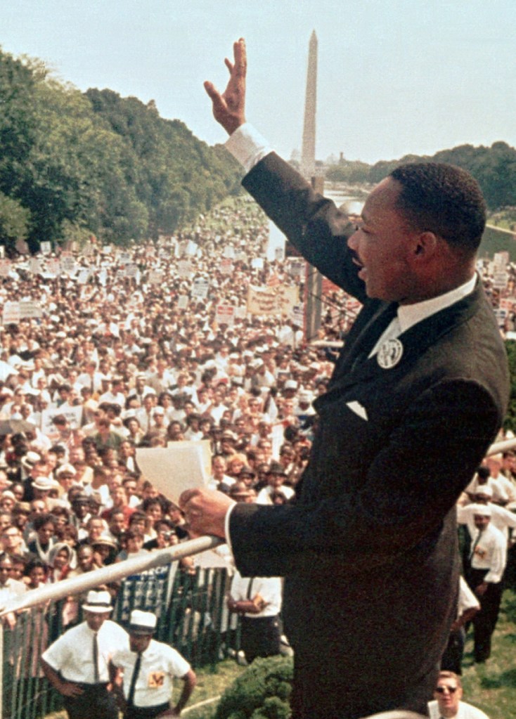 The Rev. Martin Luther King Jr. acknowledges the crowd at the Lincoln Memorial for his "I Have a Dream" speech during the March on Washington on Aug. 28, 1963.