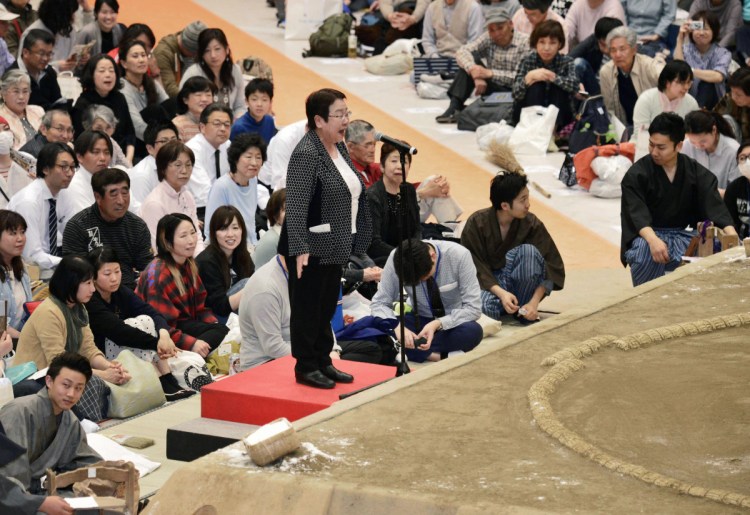 Tomoko Nakagawa, mayor of Takarazuka City, delivers a speech outside a sumo ring at a sumo exhibition in Takarazuka City, Japan, on Friday.