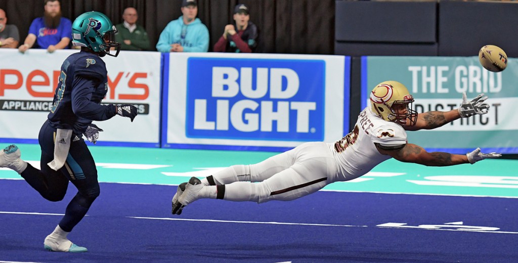 WORCESTER - Maine Mammoths Maurice Dupree makes a diving attempt at a catch as Massachusetts Pirates' Kiante Northington trails the play at the DCU Center, during the Pirates' National Arena League home opener, Saturday, April 7, 2018.
[T&G Staff/Steve Lanava]