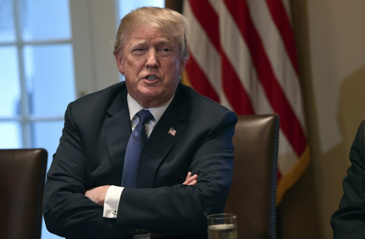 President Trump speaks in the Cabinet Room of the White House in Washington on Monday. The warrants ignited the president's anger, with Trump calling it a "disgrace" that federal agents "broke into" the office of his personal attorney. He also called special counsel Robert Mueller's investigation "an attack on our country."