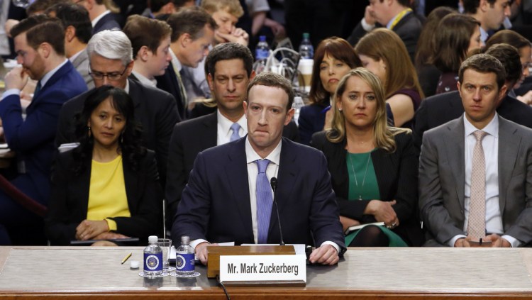 Facebook CEO Mark Zuckerberg testifies before a joint hearing of the Commerce and Judiciary committees on Capitol Hill in Washington on Tuesday about the use of Facebook data to target American voters in the 2016 election.