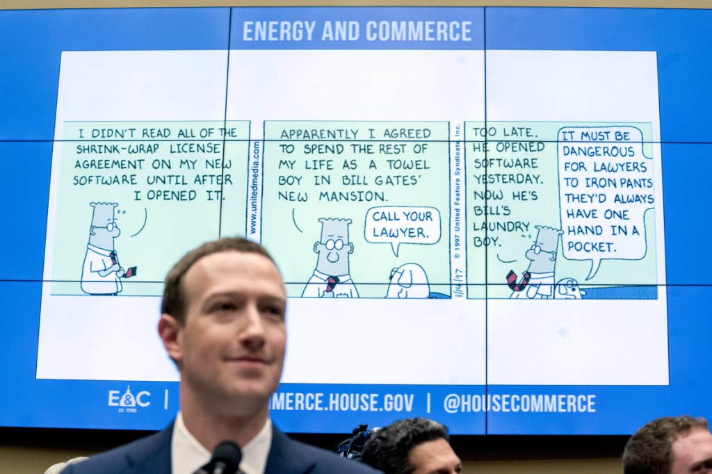 A cartoon is displayed during questioning by Rep. Michael Burgess, R-Texas, of Facebook CEO Mark Zuckerberg at a House Energy and Commerce hearing on Capitol Hill in Washington on Wednesday about the use of Facebook data to target American voters in the 2016 election and data privacy.
