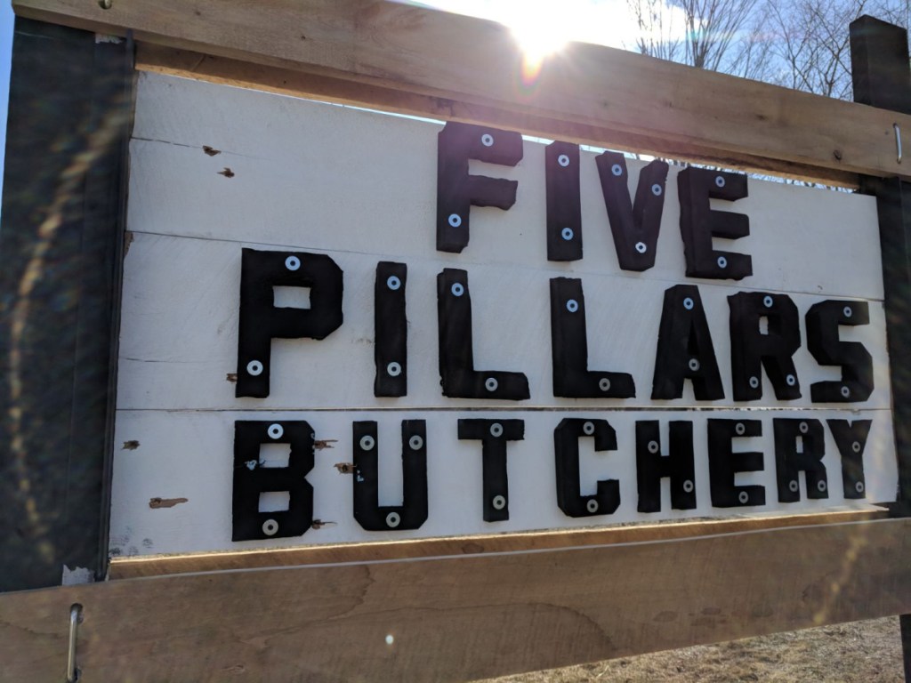 Eight bullets were shot into the sign advertising Hussam Alrawi's butchery in Troy, shortly after he put it up.