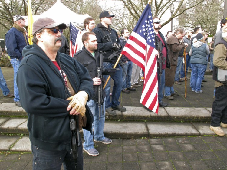 Pro-gun demonstrators attend at a rally outside the state Capitol in Salem, Oregon, in 2013. Organizers are encouraging gun rights supporters to bring unloaded weapons to rallies at state capitols across the U.S. this weekend to counter a recent wave of student-led protests against gun violence.