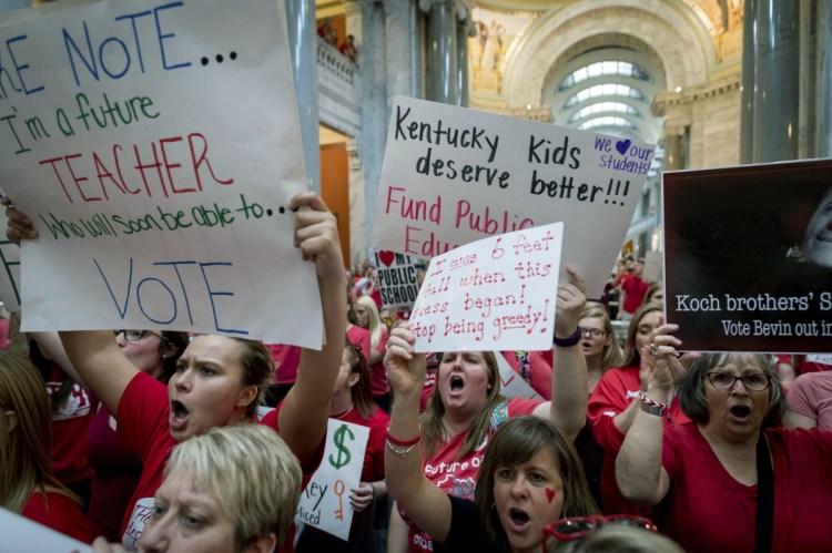Teachers from across Kentucky gather inside the state Capitol to rally for increased funding for education Friday, forcing more than 30 school districts to close.