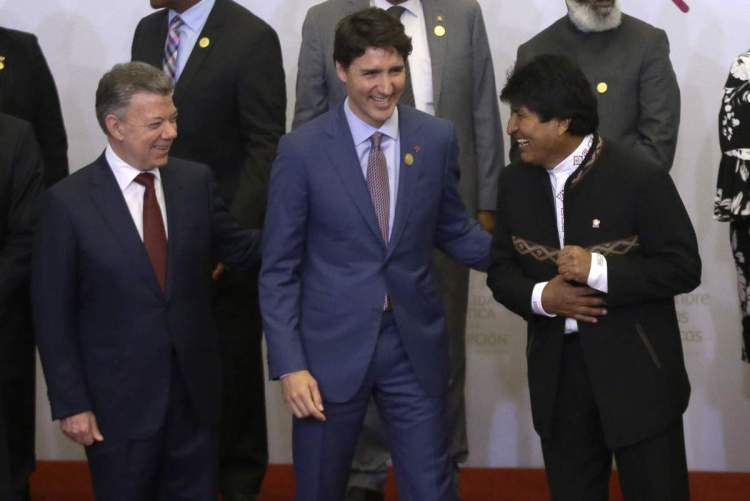 Colombia's President Juan Manuel Santos, from left, Canada's Prime Minister Justin Trudeau and Bolivia's President Evo Morales join in a group photo at the Americas Summit.