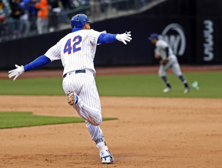 Wilmer Flores of the New York Mets circles the bases Sunday after hitting a walk-off homer against the Milwaukee Brewers.