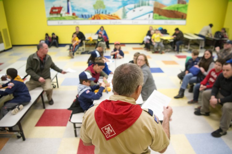 Willie LeHay reads announcements about up coming trips during a Kennebec County Cub Scout pack meeting at Williams Elementary School in Oakland on Tuesday.