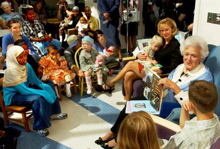 Barbara Bush reads to a group of children patients at Barbara Bush Children's Hospital in Portland during a visit by the former first lady in September 2003, when it was announced that the hospital planned a large addition.