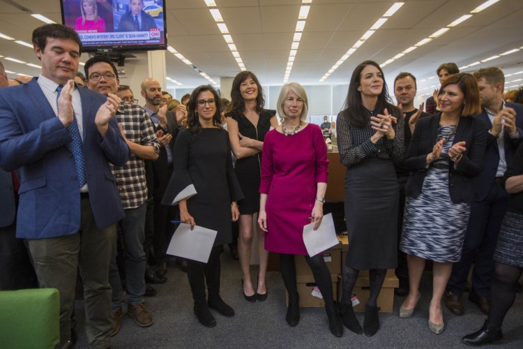 Rebecca Corbett, center, assistant managing editor of The New York Times and a former Morning Sentinel editor, stands amid Times staff Monday as they applaud the announcement that she and two reporters to her right, Megan Twohey and Jodi Kantor, have won the Pulitzer Prize for Public Service, chronicling the decades of sexual harassment perpetrated by Harvey Weinstein and other powerful men and helping to ignite the #MeToo movement.