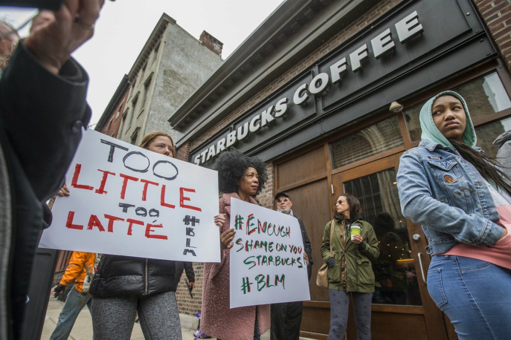 Protesters gather Sunday outside of a  Starbucks in Philadelphia where two black men were arrested Thursday after employees called police to say the men were trespassing. The arrest prompted accusations of racism on social media. Starbucks CEO Kevin Johnson posted a lengthy statement Saturday night, calling the situation "disheartening" and that it led to a "reprehensible" outcome.