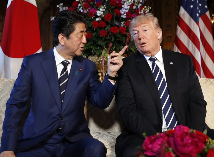 President Trump and Japanese Prime Minister Shinzo Abe speak during a meeting at Trump's private Mar-a-Lago club on Tuesday in Palm Beach, Fla.