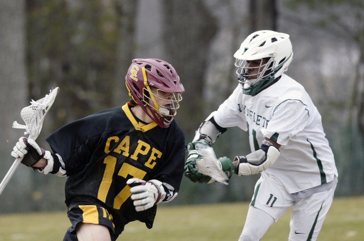Cape Elizabeth, a Class C school by enrollment, moved up to be in Class A, the most competitive league. Jacob Brydson, left, had five goals and four assists in the opener.