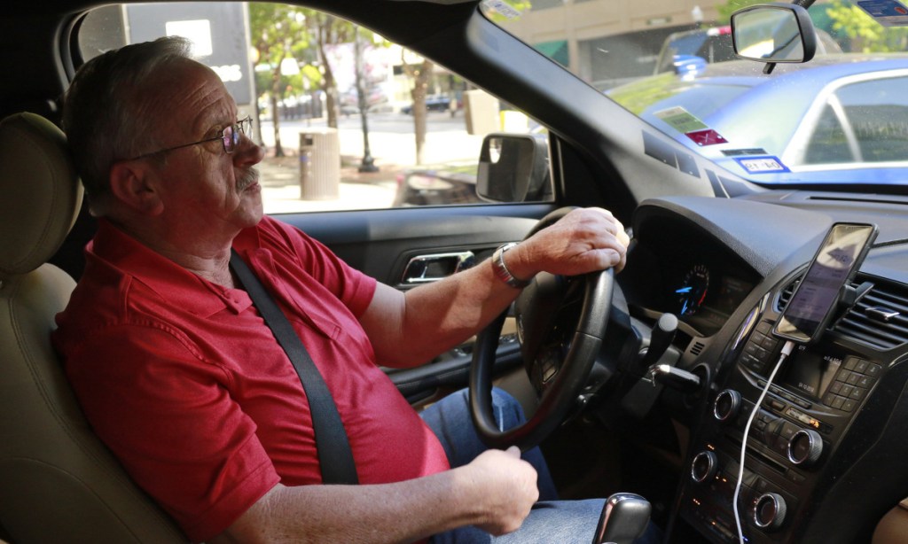 Uber driver Johnny Pollard of Haltom City, Texas, says he grosses $1,200 to $1,800 per week with his car and a mileage tracker, left, shuttling customers around the Dallas-Fort Worth region. The former truck driver says his freelance job saved him from the unemployment line.