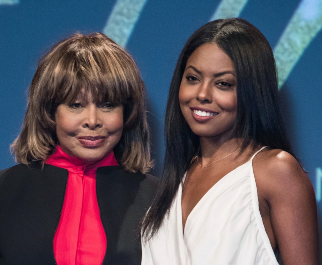 Tina Turner, left, poses with actress Adrienne Warren, who plays Turner in the musical "Tina." Turner attended opening night Tuesday and joined the cast on stage for the curtain call.