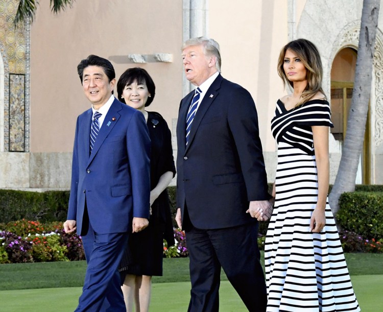 From left, Japanese Prime Minister Shinzo Abe; his wife, Akie; and President Trump and his wife, Melania, walk before dinner at Mar-a-Lago in Palm Beach, Florida, on Wednesday.