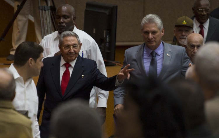 Cuba's President Raul Castro, center left, enters the National Assembly followed by his successor Miguel Diaz-Canel, center right, on Wednesday.