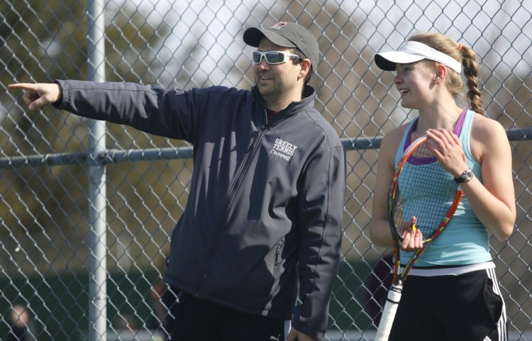 Greely Coach Ben Caswell chats at practice with senior Izzy Evans, who plays at No.1 singles for the Rangers.